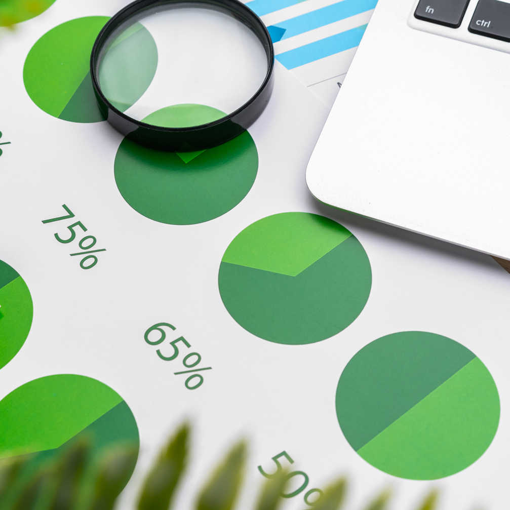 Financial Report And Laptop On Business Desk