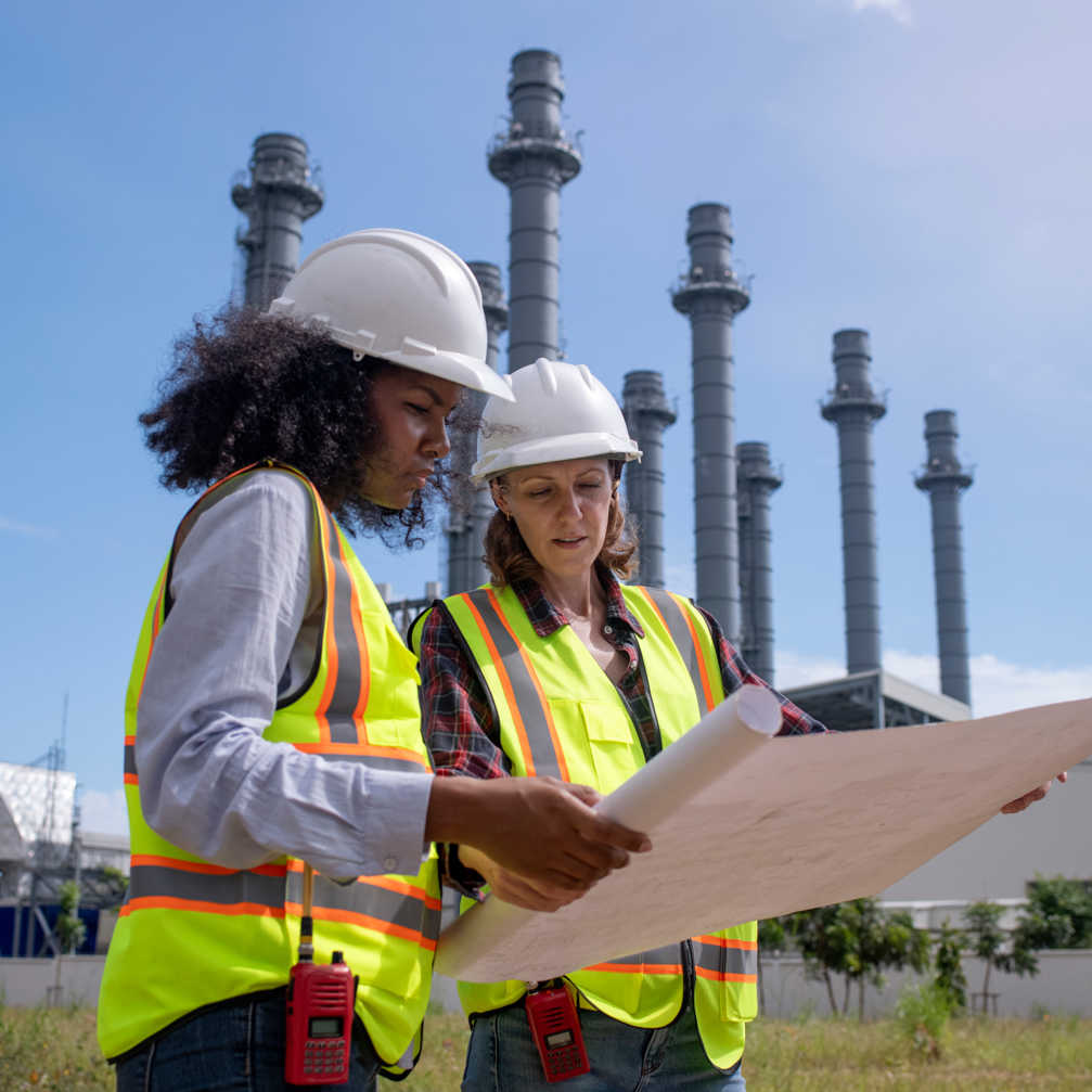 Engineers Wearing Safety Gear Including Hard Hats