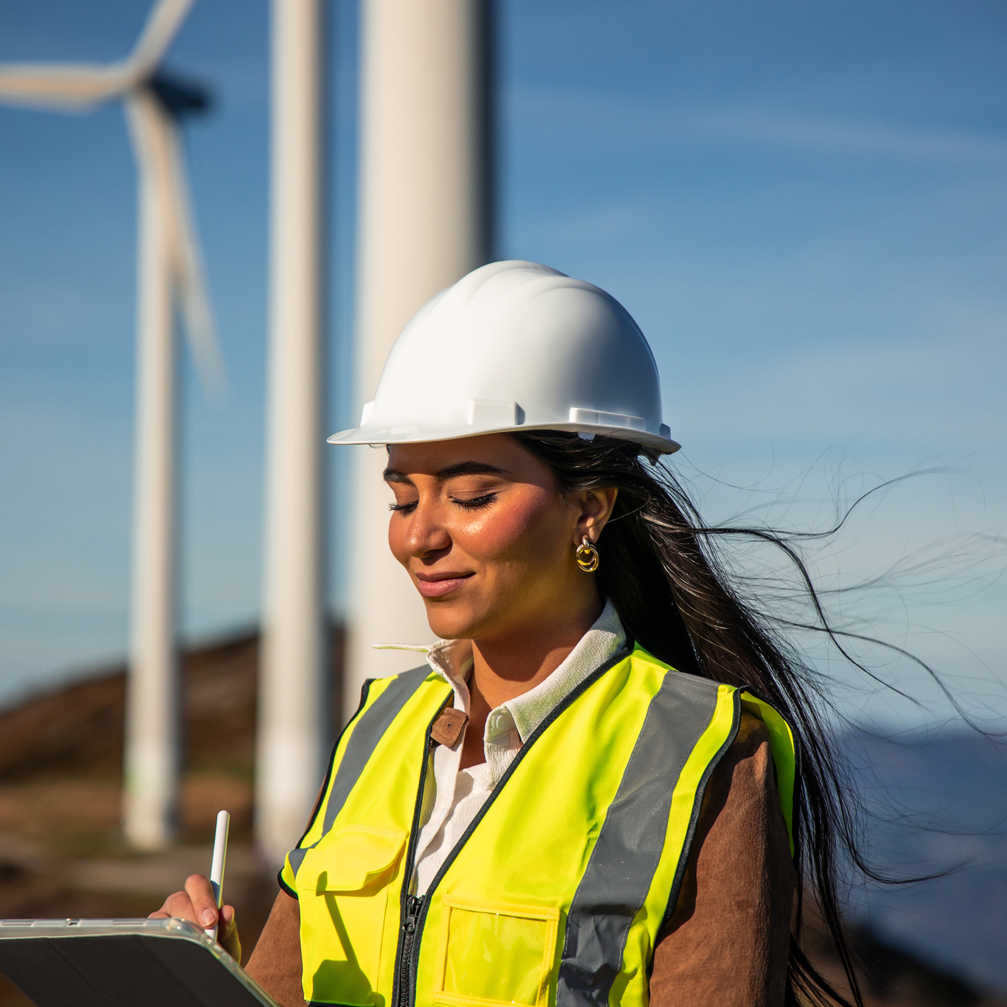 Latin Female Engineer Inspecting Wind Turbines Ta 2025 06 22 18 41 15 Utc